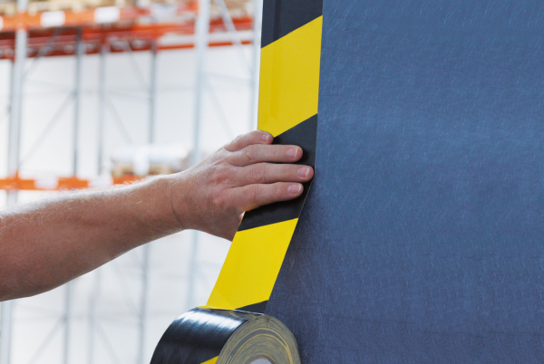 Application of the tape on a wall